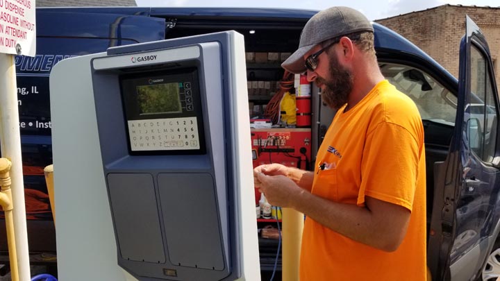 Technician installing Gasboy card reader